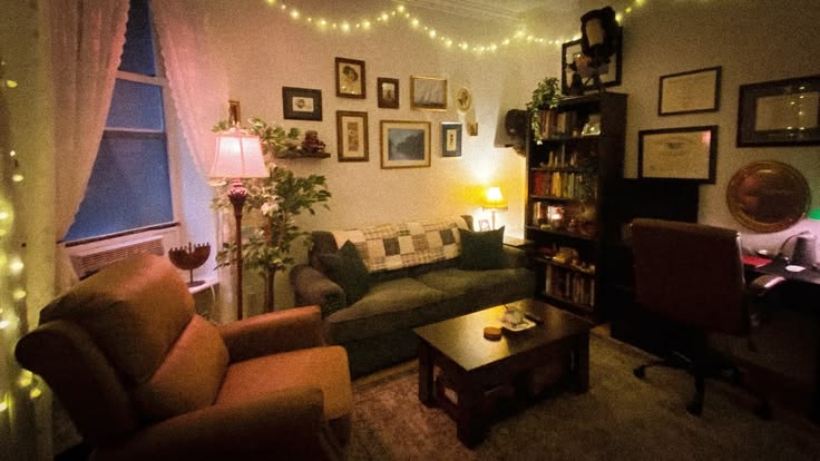 A warm, cluttered living room with string lights and wallful