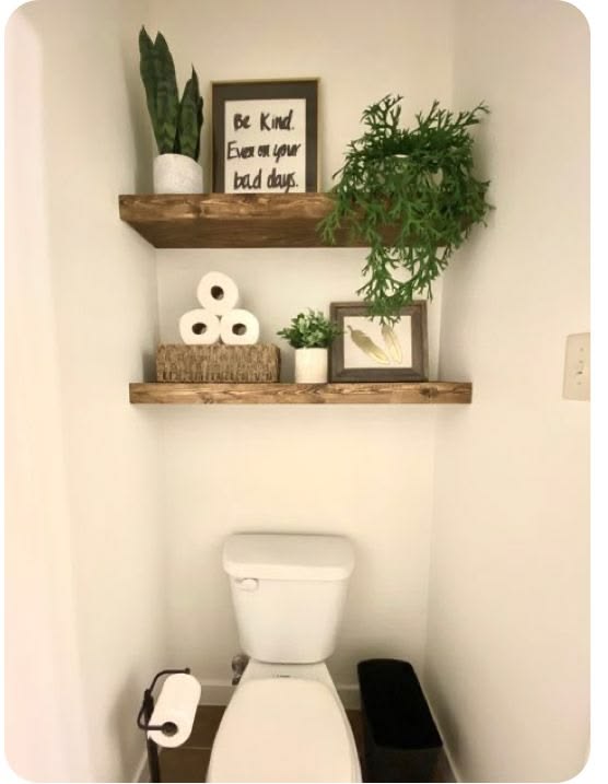 Discover a fresh home vibe: White toilet, lush plants, and o