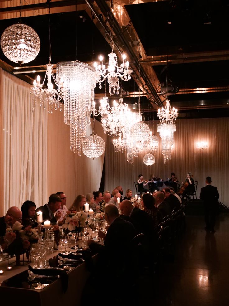 Elegant chandelier set up with dusty pink chiffon drape for 