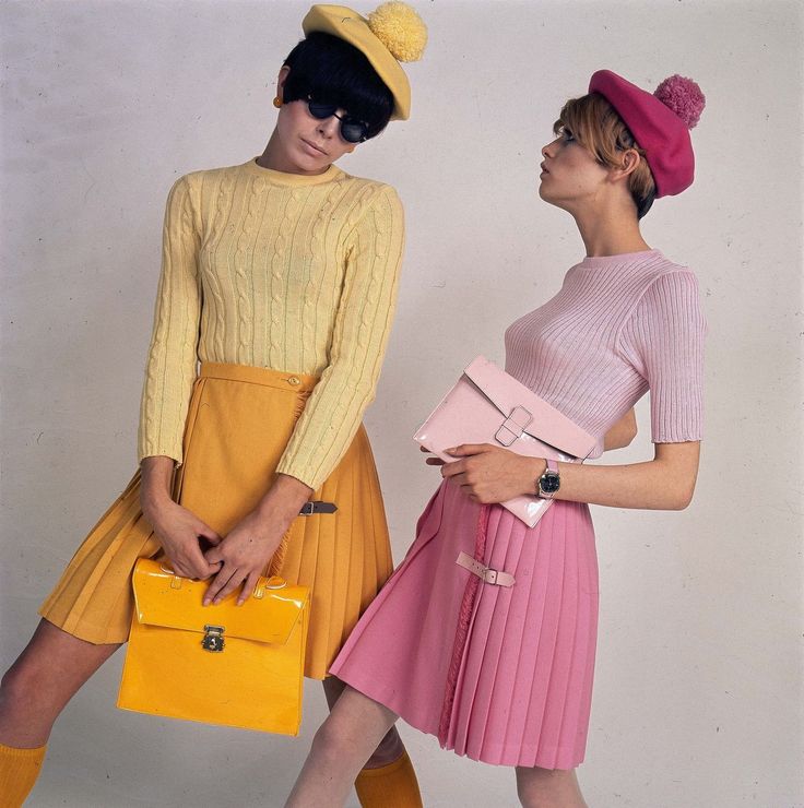 1966 Twiggy (right) poses with another model in coordinating