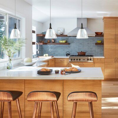 This classic pendant features on clear handblown bell glass 