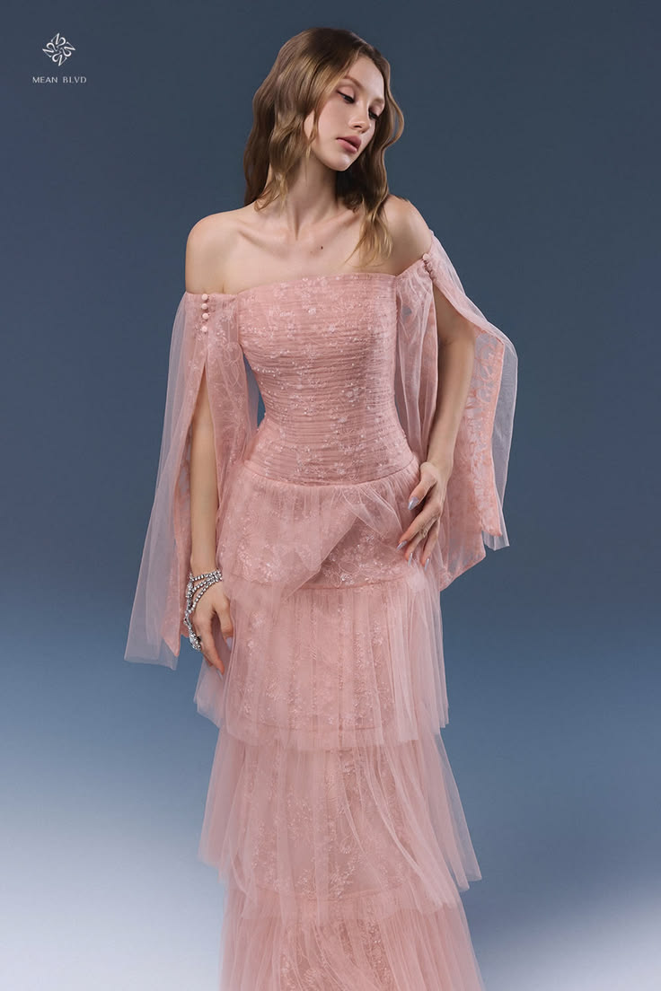 Romantic blush pink tulle dress with corset structure, sheer