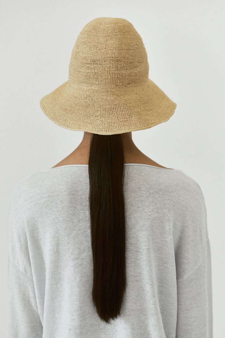 Packable natural raffia bucket hat for vacation packing and 