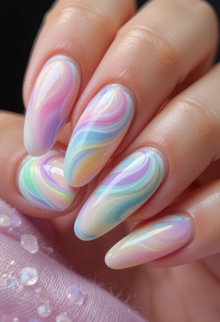 Whimsical and sweet, these pastel rainbow swirl nails are a 