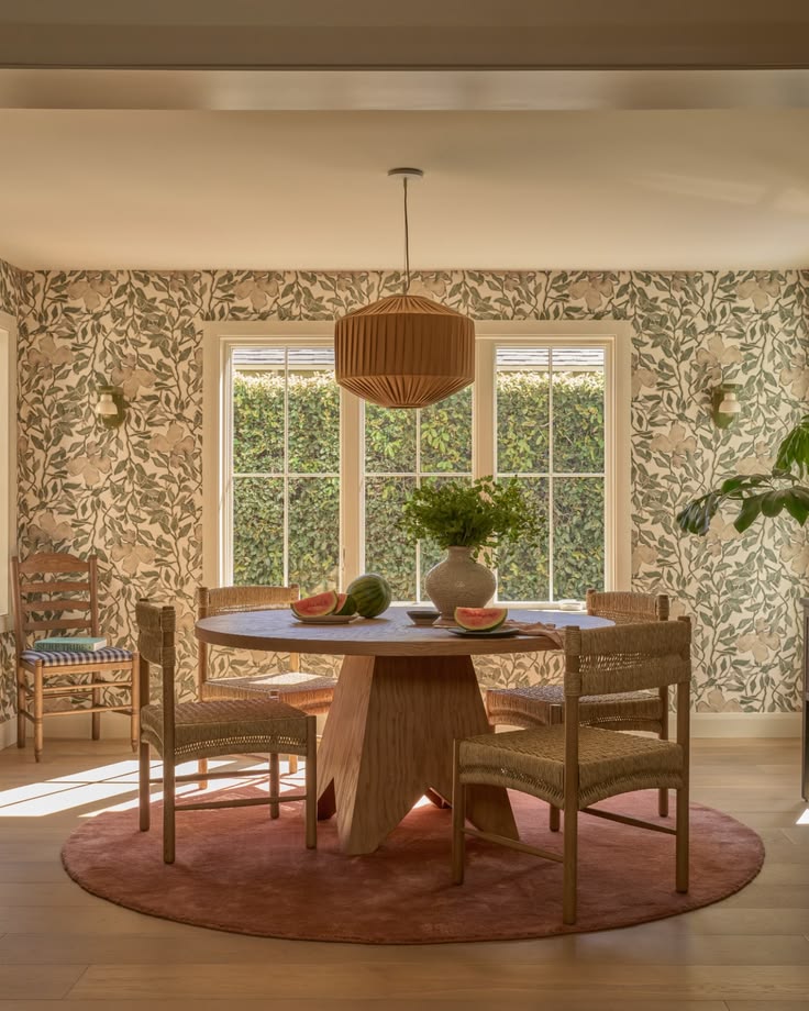 This modern dining room blends pattern and warmth with flora