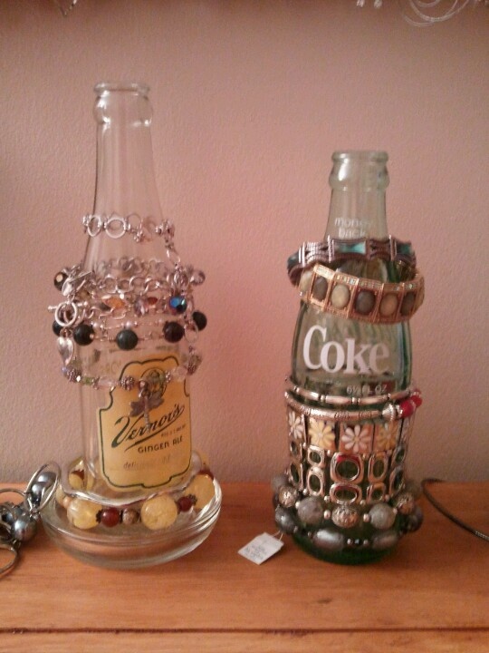 Using old/antique bottles to organize bracelets.
