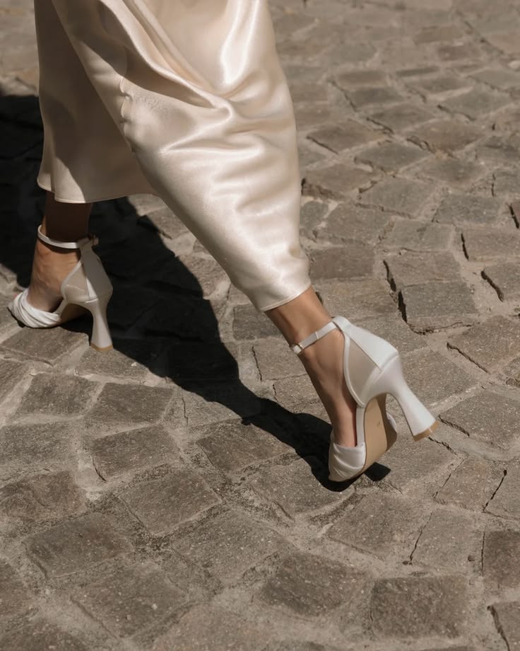 Crafted from a soft and creamy vintage ivory satin, this mod