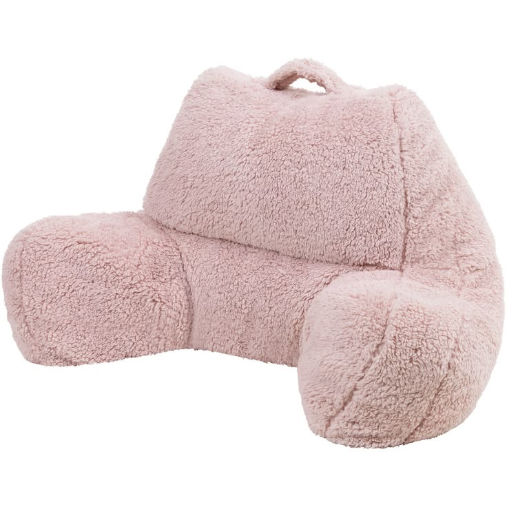 Charming pink stuffed animal sits atop a soft pillow—perfect
