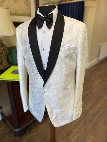 A white dinner suit is the perfect way to make the groom sui