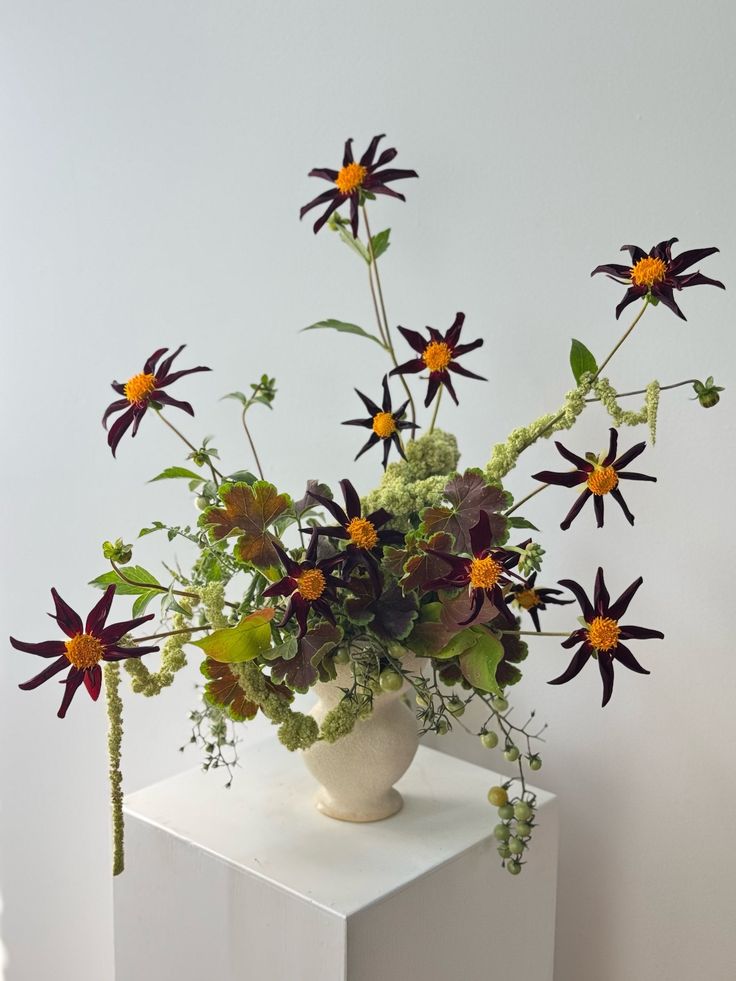 A fresh still life. Seasonal Maine-grown flowers meet a hand