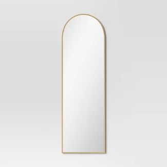 Elevate your space with a stylish gold arch mirror. Perfect 