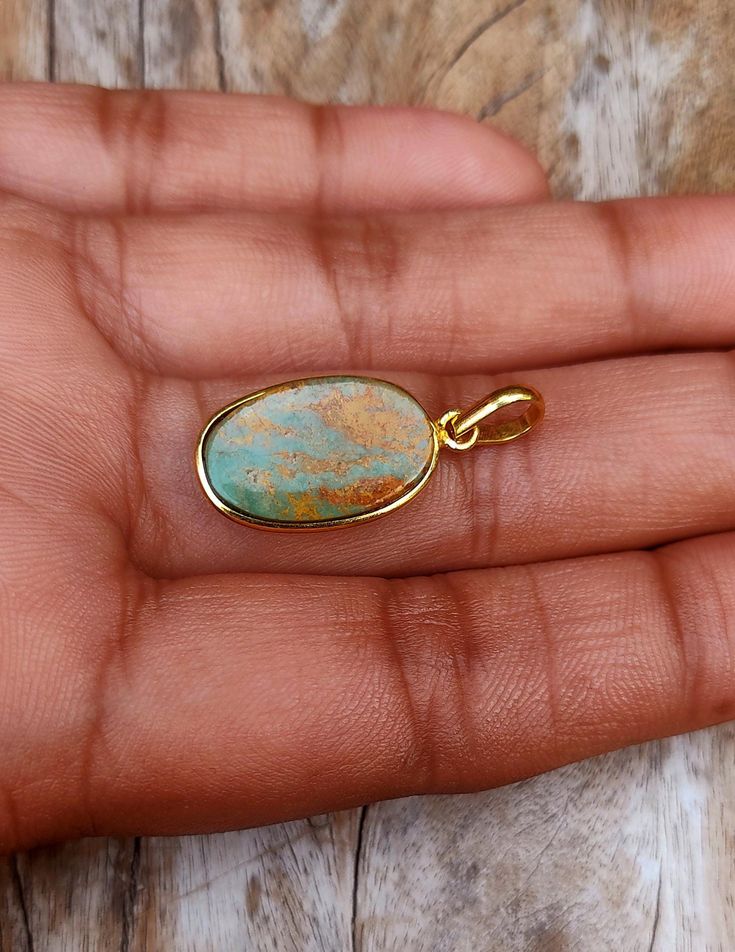 This Natural Turquoise Gold Pendant is a stunning piece of f