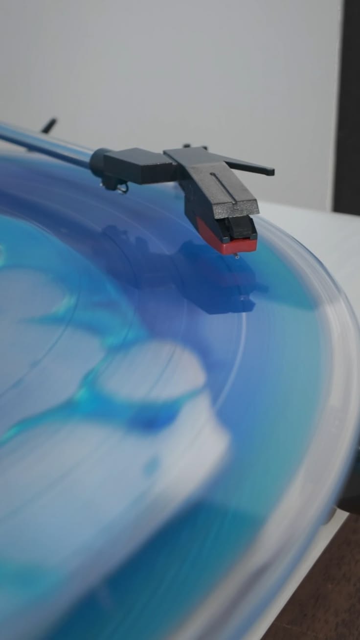 Oddly satisfying blue liquid filled vinyl spinning