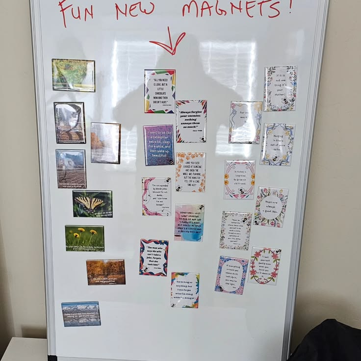 Taking a picture of myself on the white board behind my magn