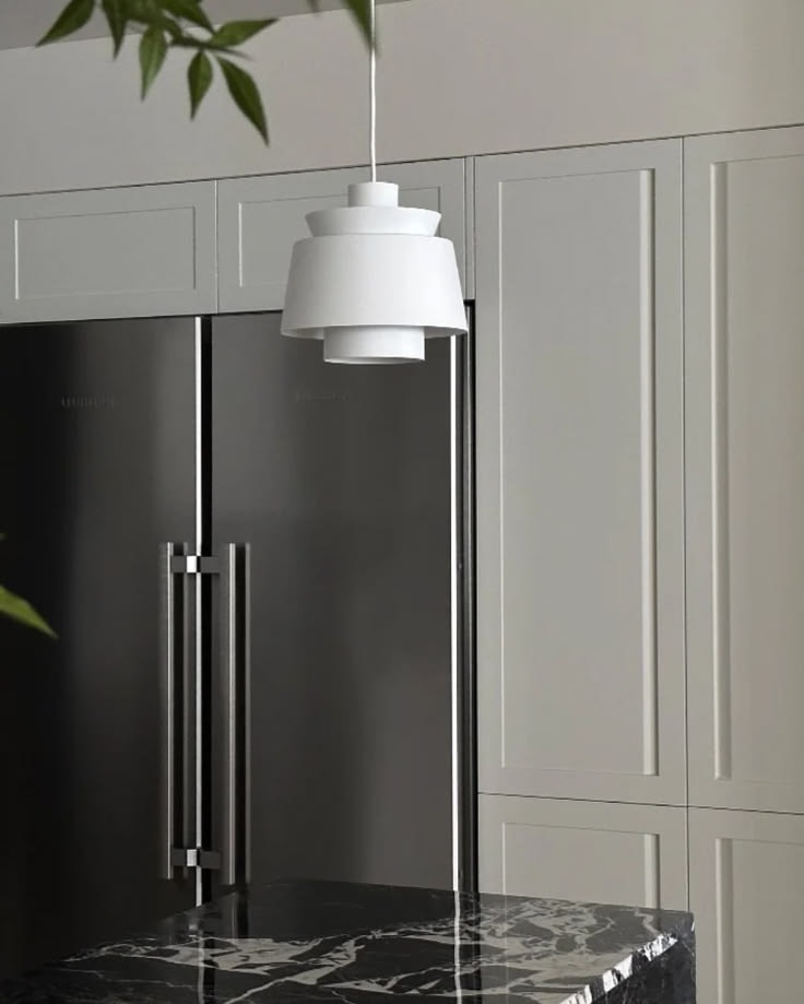 The Echo Pendant Light features a sculptural arrangement of 