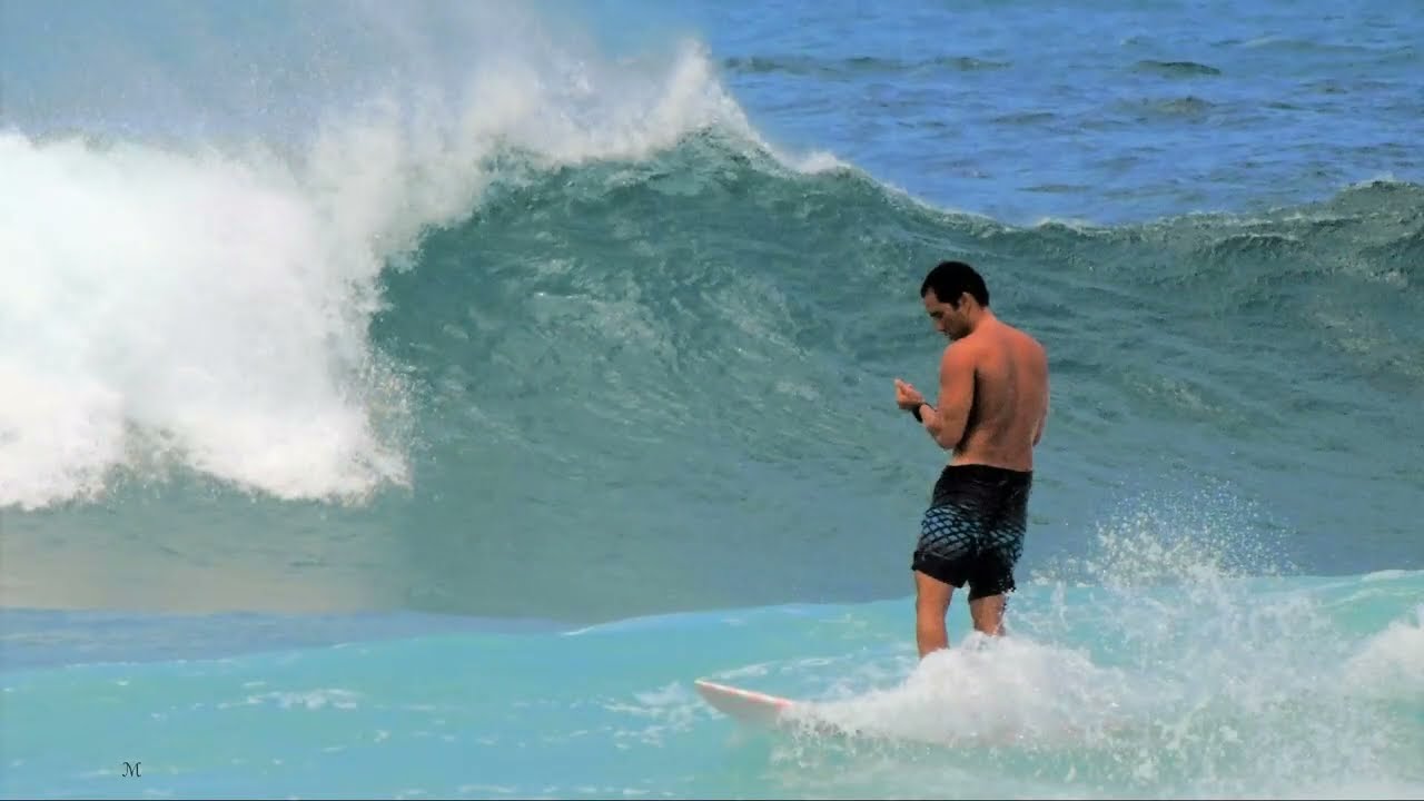 surfers be surfing in Hawaii