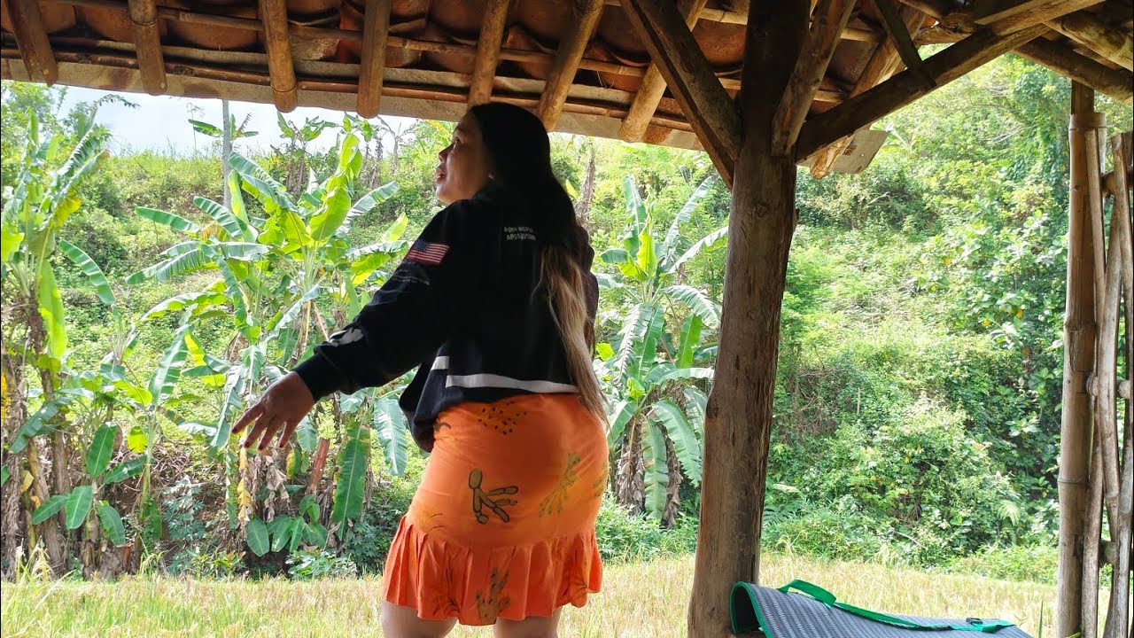 Young mother goes on an adventure to cook delicious natural products in a bamboo hut and relax